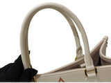 Louis Vuitton On The Go MM Handbag Monogram Implant Creme