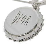 Dior Logo Bottle Cap Brooch