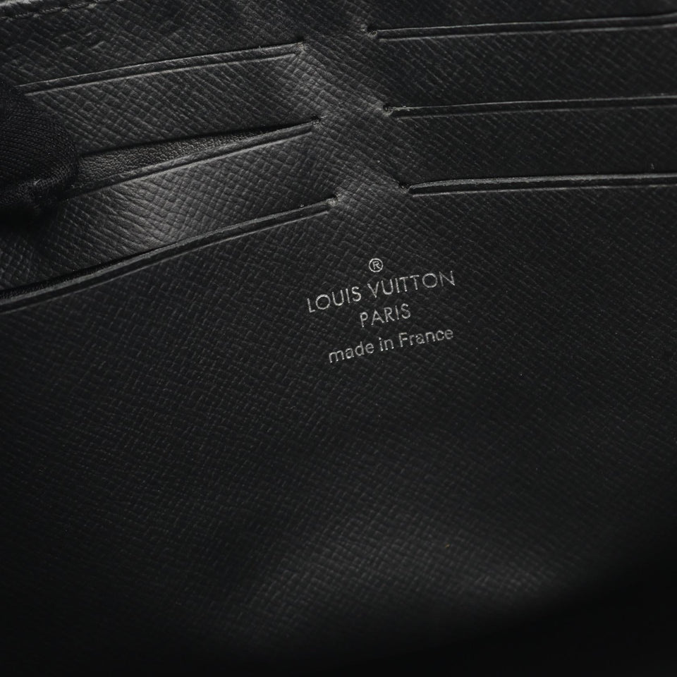Louis Vuitton Pochette Voyage Taiga Clutch Bag