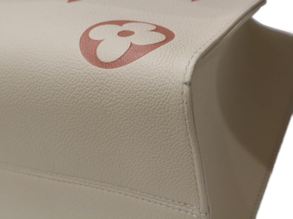 Louis Vuitton On The Go MM Handbag Monogram Implant Creme