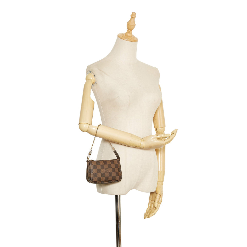 Louis Vuitton Damier Ebene Mini Pochette Accessoires Brown Clutch