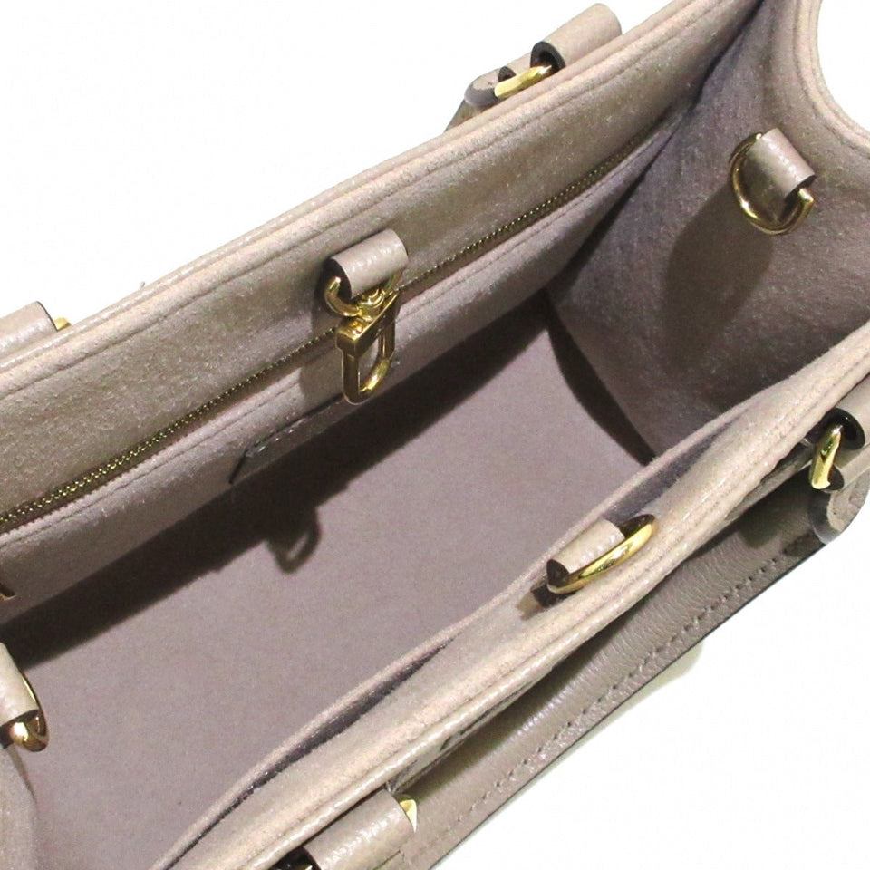 Louis Vuitton On The Go PM Handbag Tourtrail Creme Embossed