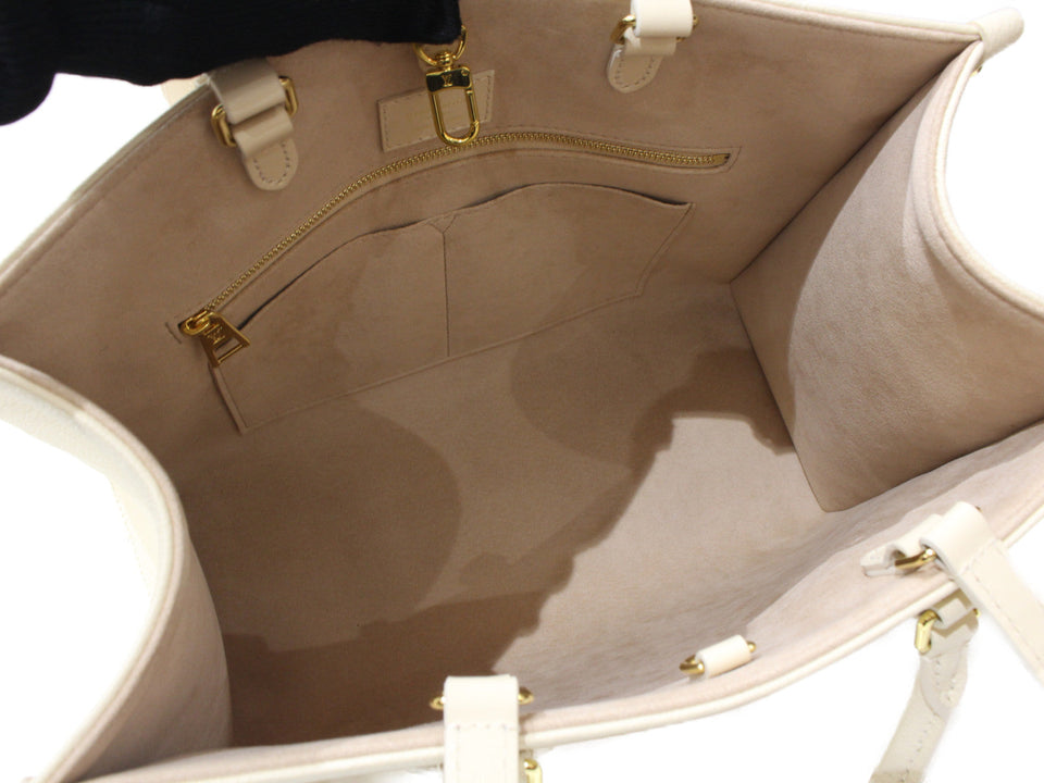 Louis Vuitton On The Go MM Handbag Monogram Implant Creme