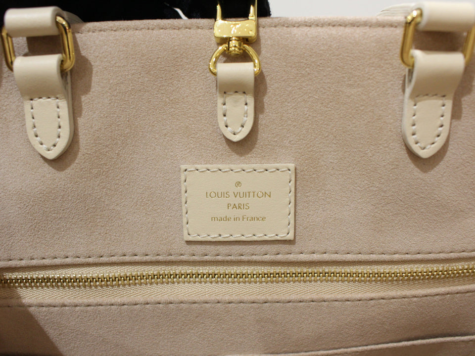 Louis Vuitton On The Go MM Handbag Monogram Implant Creme