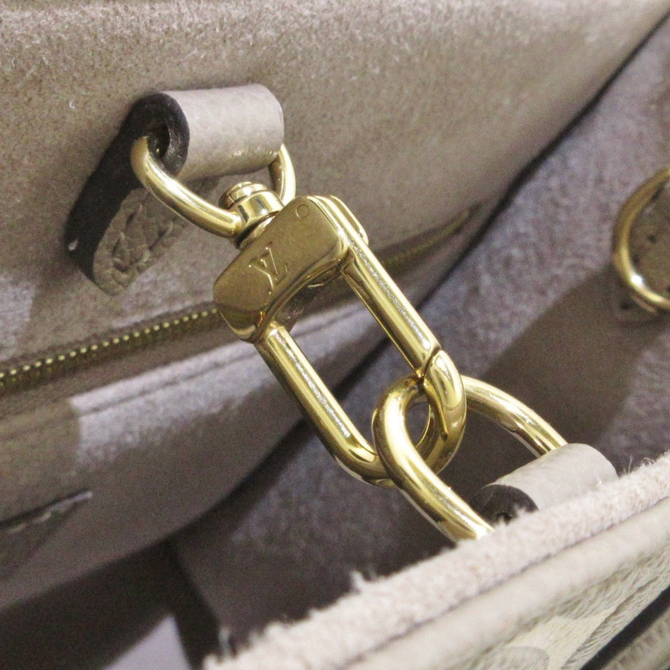 Louis Vuitton On The Go PM Handbag Tourtrail Creme Embossed