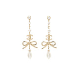 Chanel pearl / cc logo / bow tie drop earrings gold tone