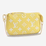 Louis Vuitton LV Women Mini Pochette Accessoires Yellow Monogram Empreinte Embossed Supple Grained Cowhide Clutch