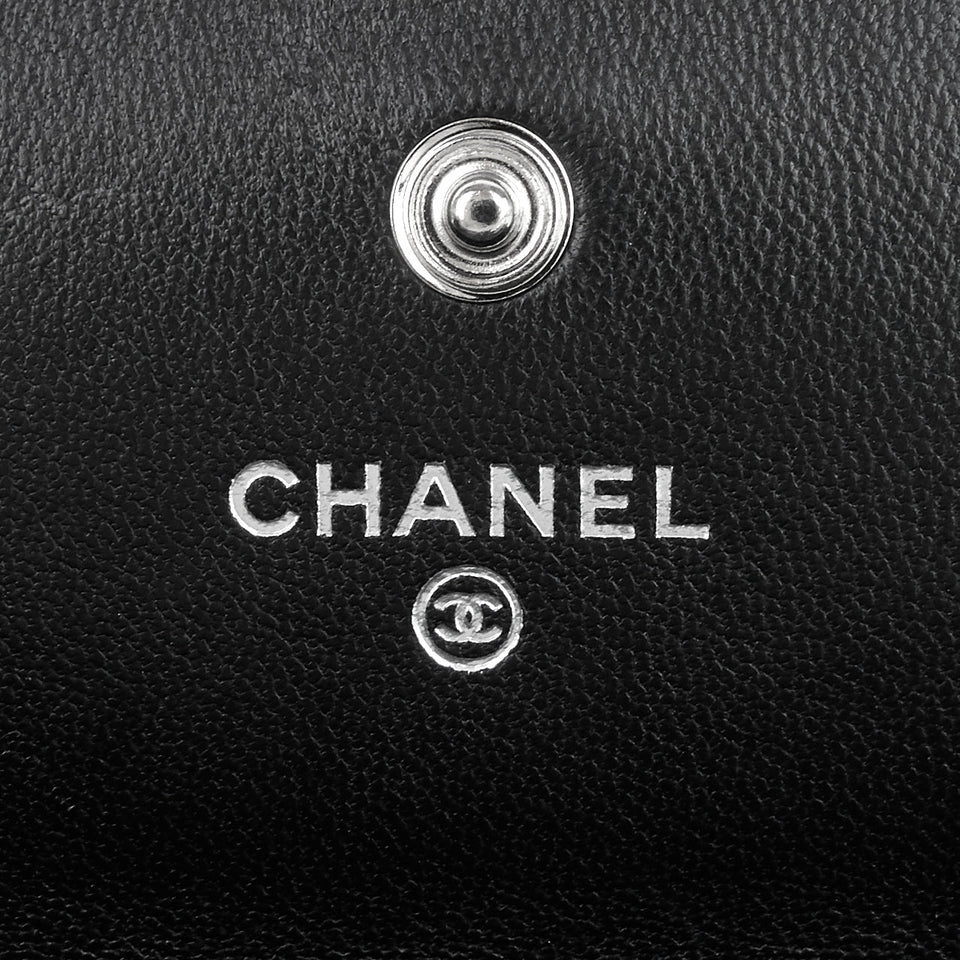 Chanel Embossed Camellia Lambskin Flap Wallet