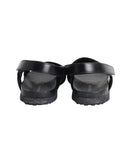 Prada Logo Strap Crisscross Sandals in Black Leather