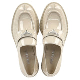 Prada Logo-Plaque Chunky Loafers in Cream Patent Leather