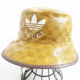 Gucci hat Outer: 67% polyamide (nylon), Outer: 33% cotton, Lining: 65% cotton, Lining: 35% linen, Partially: leather, Inner: 55% cotton, 45% viscose Beige type Gucci x Adidas collaboration mens S